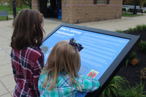 Girls-reading-the-sign-outside-the-visitor-center-From-the-Back-2